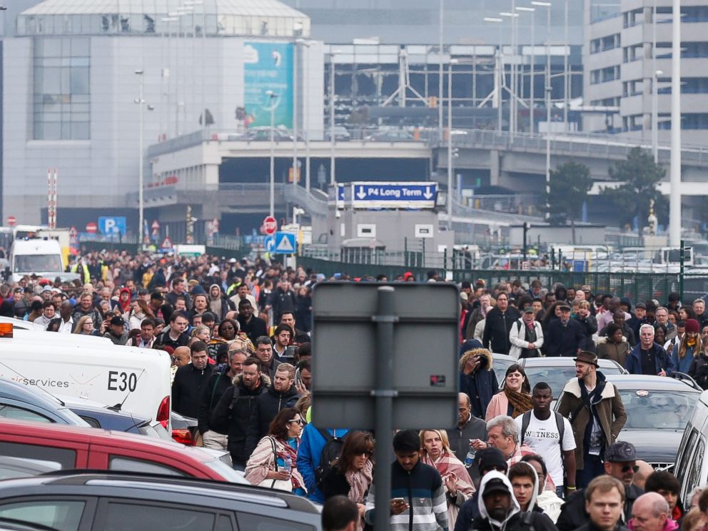 PHOTO: Passengers and airport staff are evacuated from the terminal building after explosions at Brussels Airport in Brussels, March 22, 2016. 