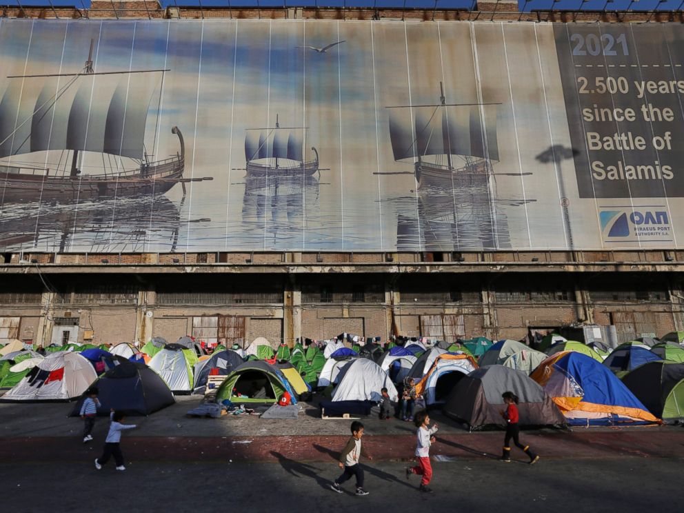 PHOTO: Migrant children play at the Athens port of Piraeus, April 4, 2016, during the first day of the implementation of the deal between EU and Turkey. 